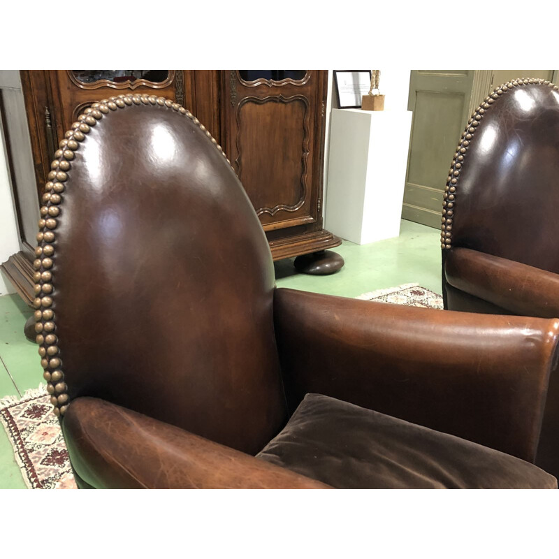 Pair of vintage french armchairs in brown leather 1950