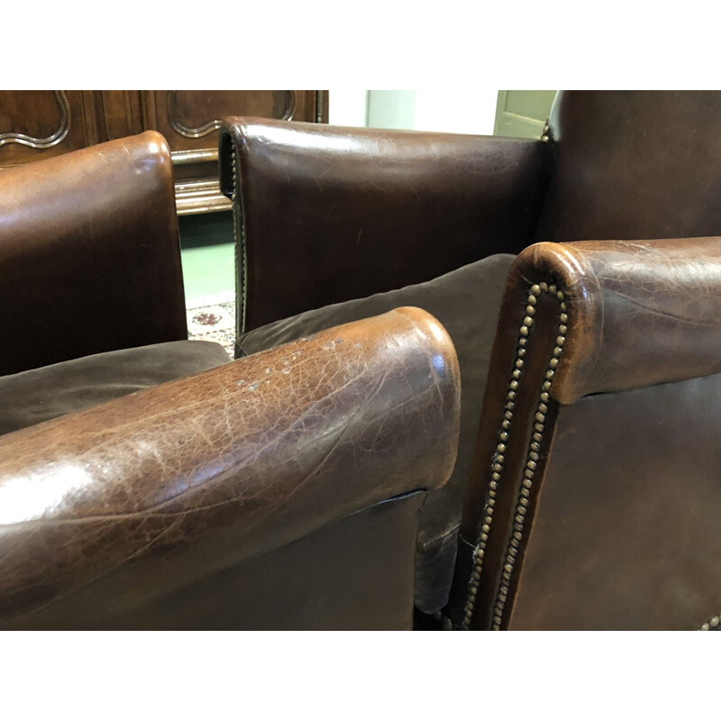 Pair of vintage french armchairs in brown leather 1950