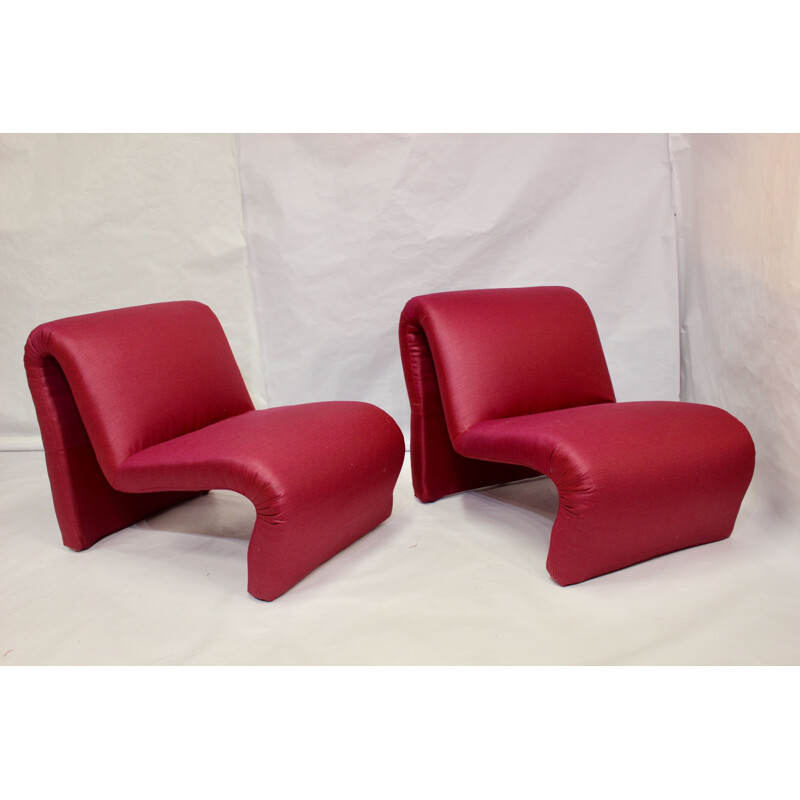 Pair of red low chairs by Etienne Fermigier