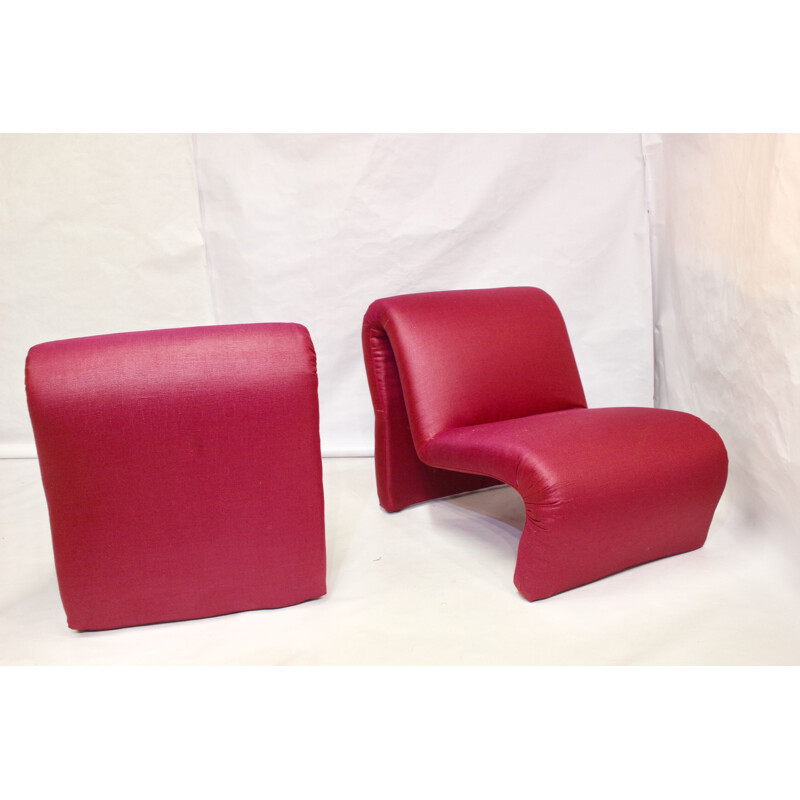 Pair of red low chairs by Etienne Fermigier