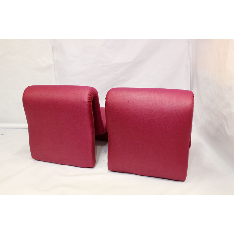 Pair of red low chairs by Etienne Fermigier