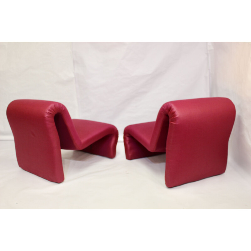 Pair of red low chairs by Etienne Fermigier