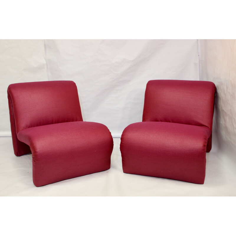 Pair of red low chairs by Etienne Fermigier