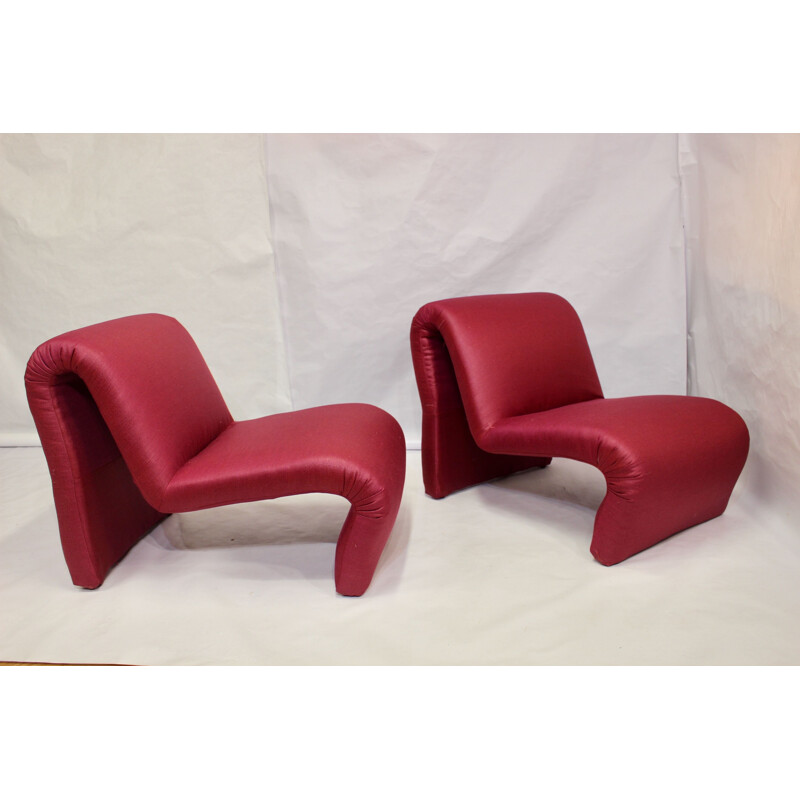 Pair of red low chairs by Etienne Fermigier