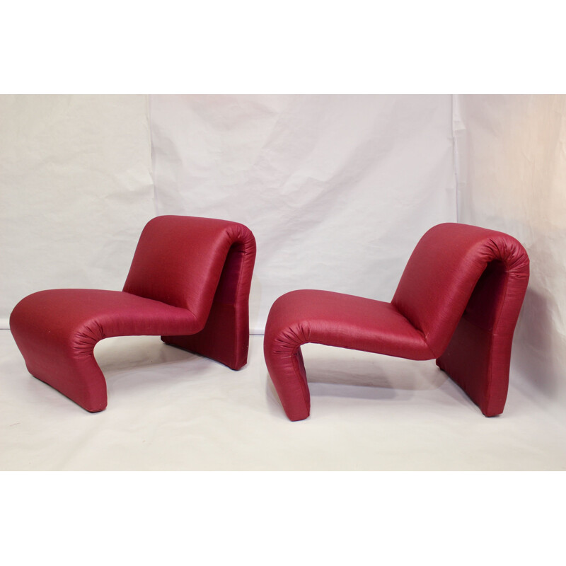 Pair of red low chairs by Etienne Fermigier