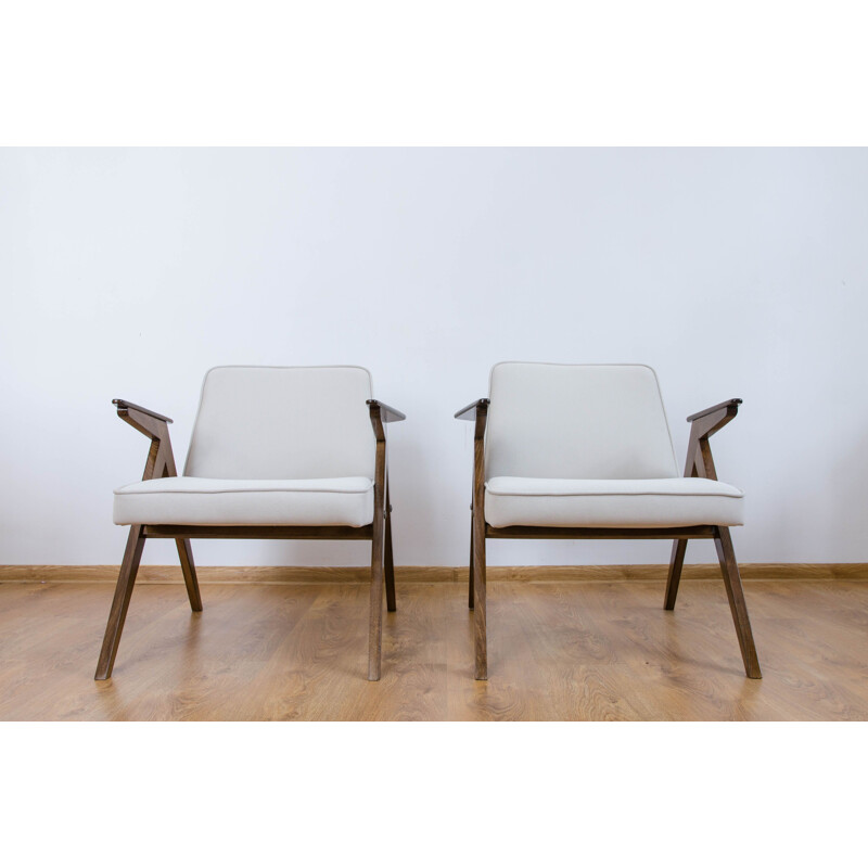 Vintage pair of white armchairs from the 60s