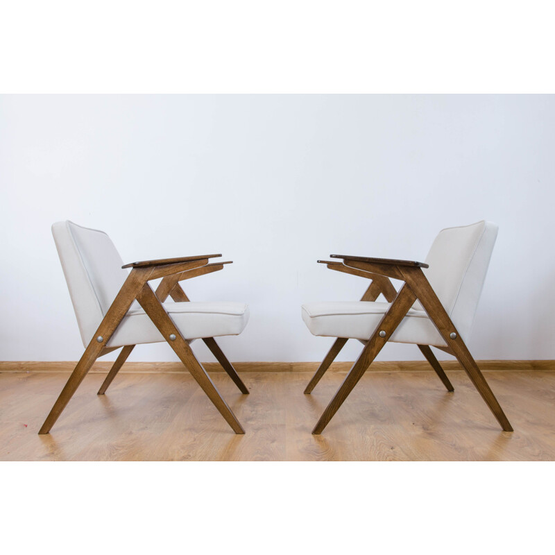 Vintage pair of white armchairs from the 60s