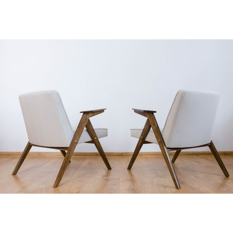 Vintage pair of white armchairs from the 60s