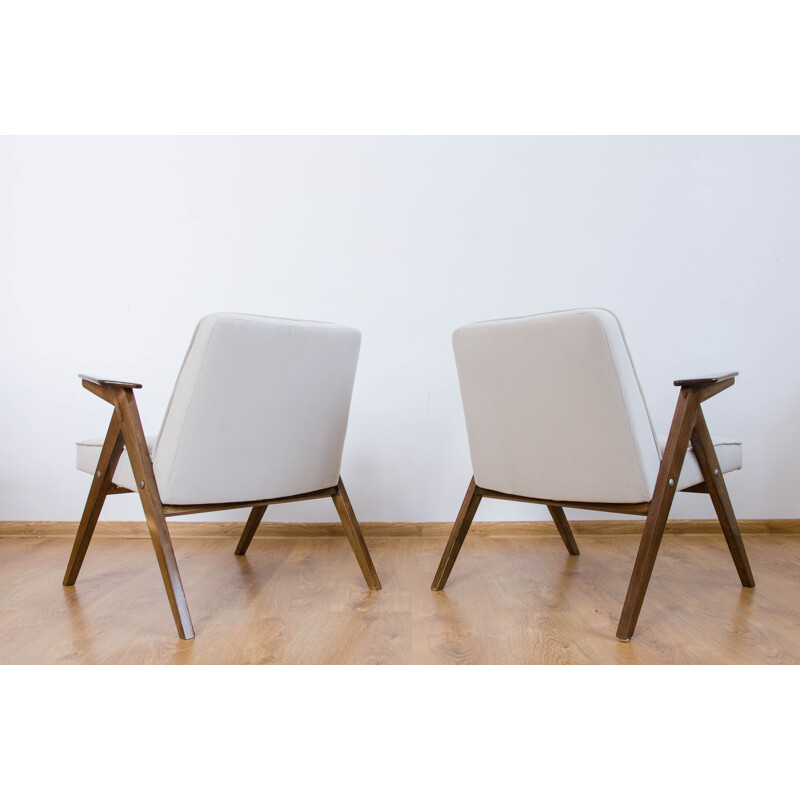 Vintage pair of white armchairs from the 60s
