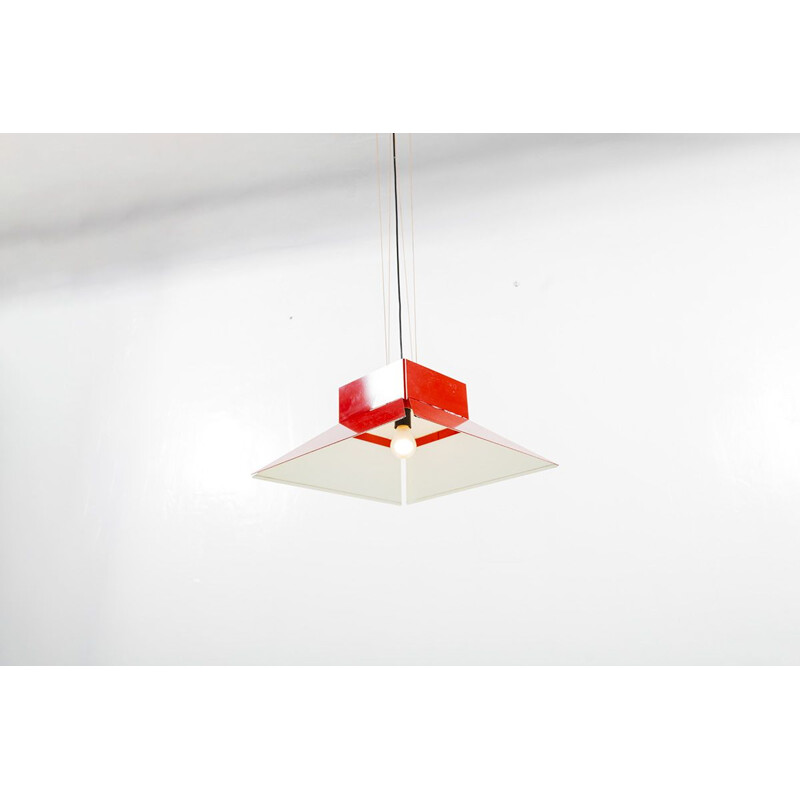 Vintage red enamelled metal shade hanging on a red ceiling light by artimeta