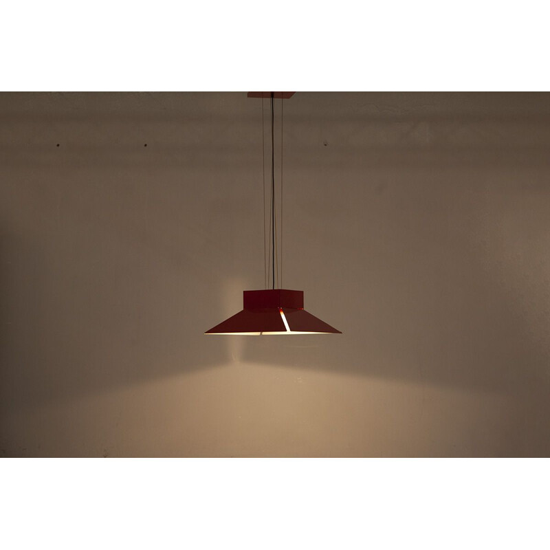 Vintage red enamelled metal shade hanging on a red ceiling light by artimeta