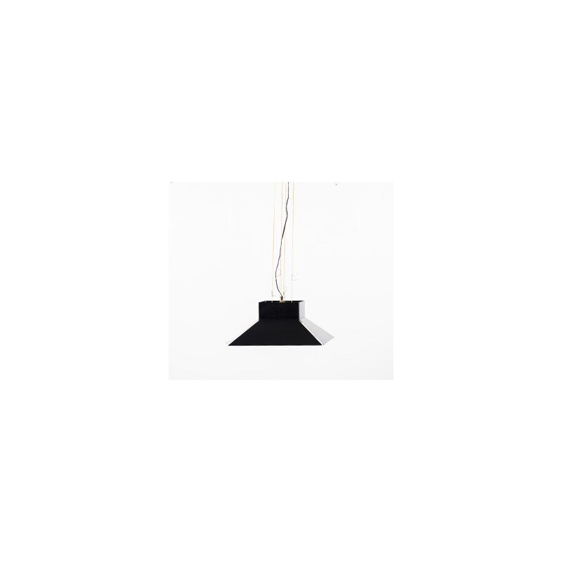 Vintage suspension a shade of black enamel metal that hangs on a black ceiling light in the same material