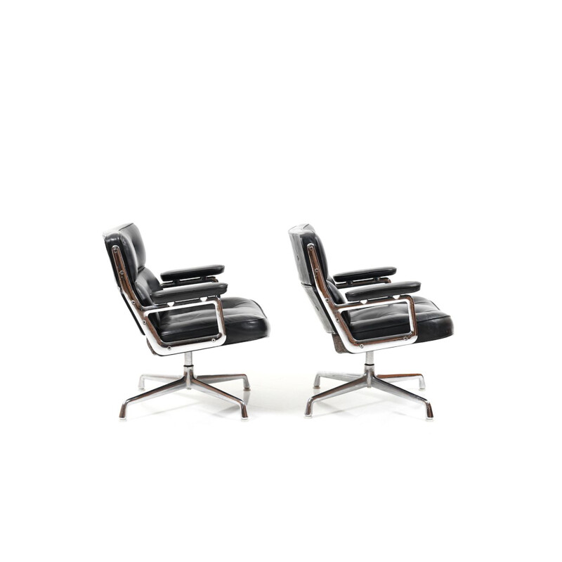 Vintage pair of black leather armchairs by Charles and Ray Eames,1950