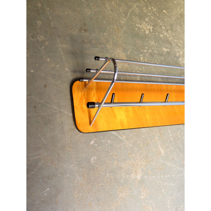 Vintage coat rack in chrome metal in blonde board