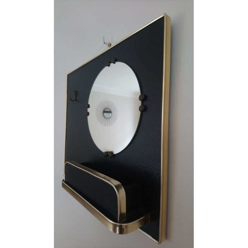Vintage mirror in black vinyl and golden metal with trinket bowl and hook 1960