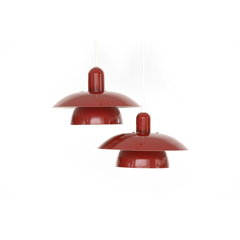 Pair of red pendant lamps by Hamalux