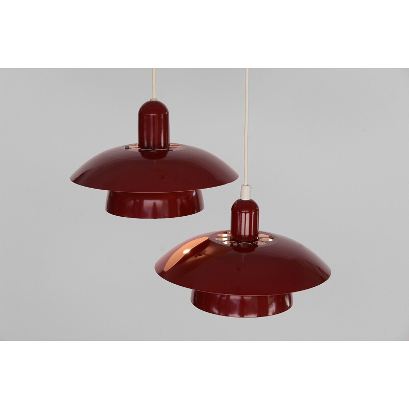 Pair of red pendant lamps by Hamalux