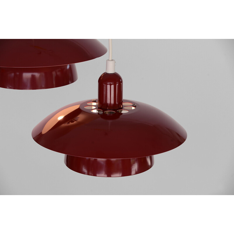 Pair of red pendant lamps by Hamalux