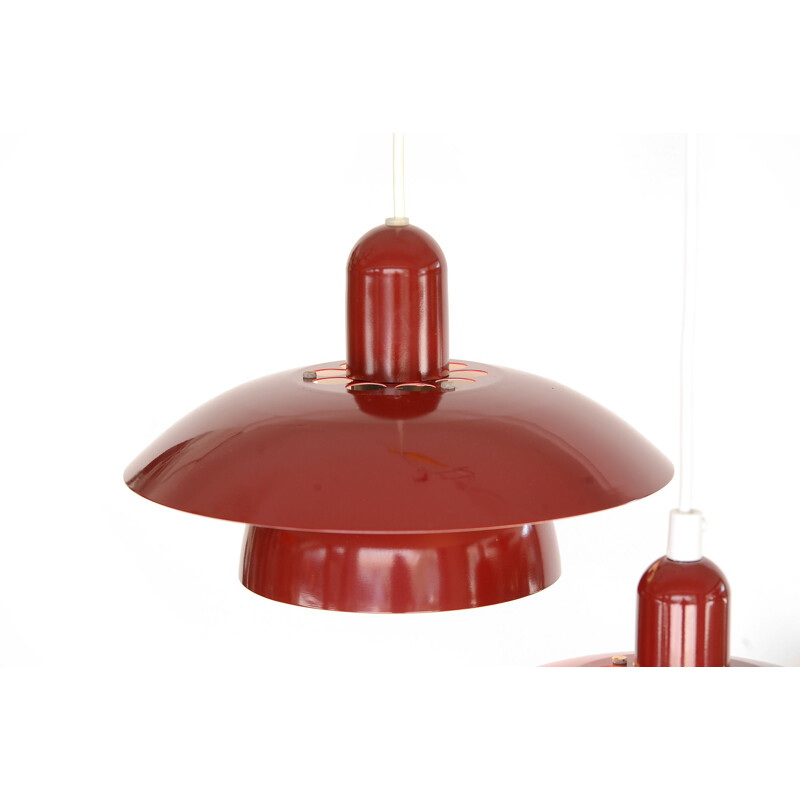 Pair of red pendant lamps by Hamalux
