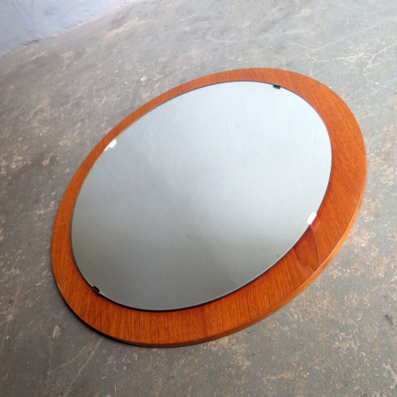 Vintage round mirror in a teak veneer frame