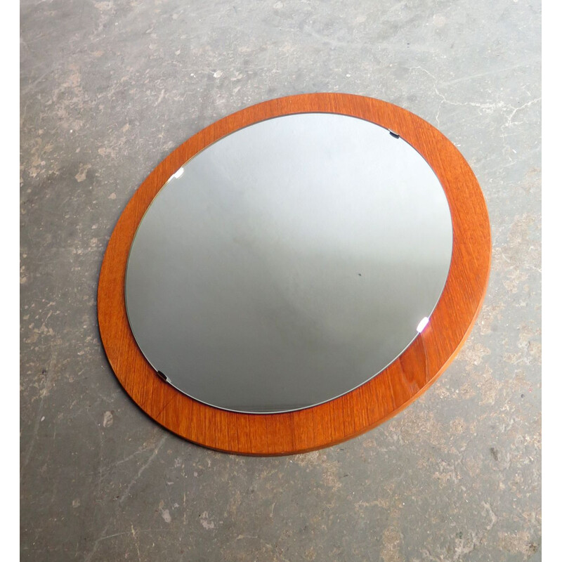 Vintage round mirror in a teak veneer frame