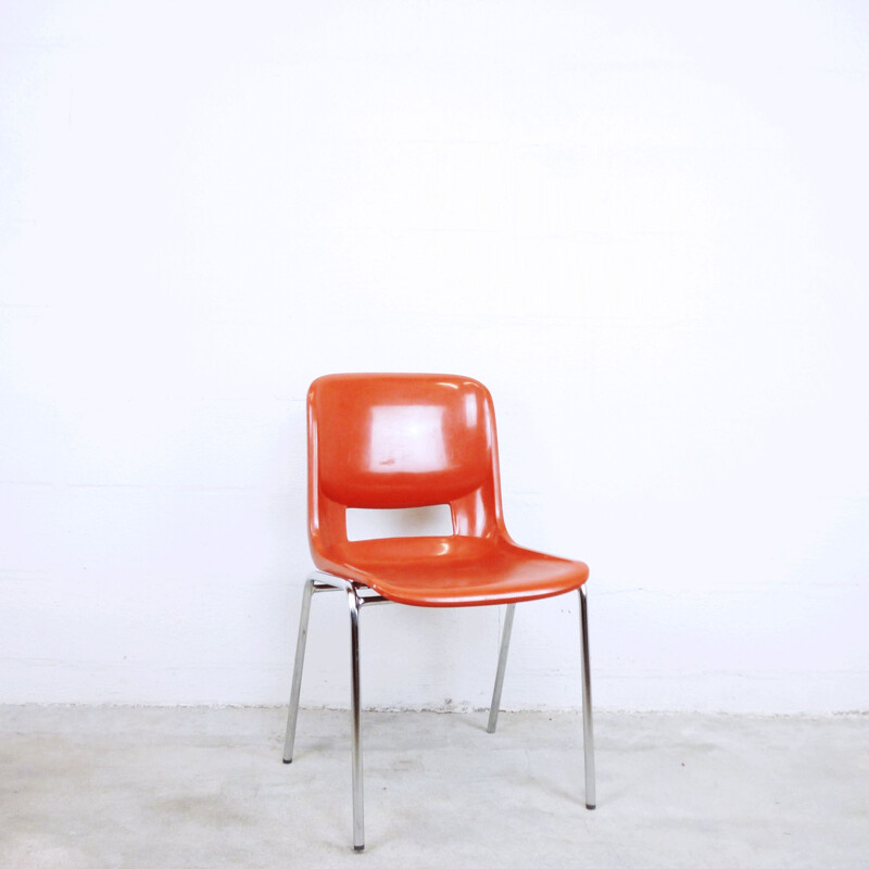 Orange school chair in plastic by ISKU OY