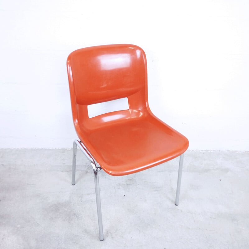 Orange school chair in plastic by ISKU OY