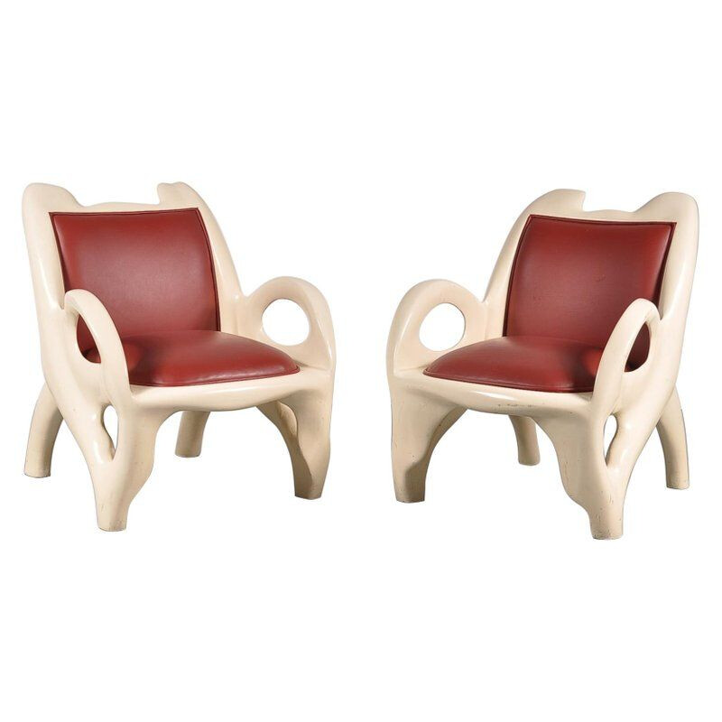 Pair of vintage armchairs in red leather and wood 1970