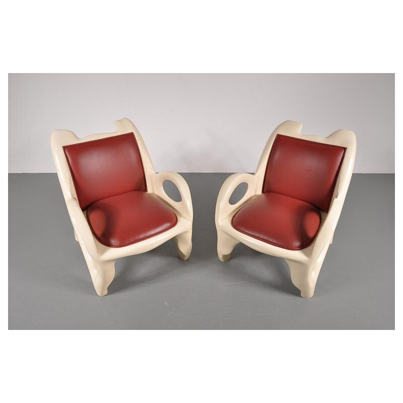 Pair of vintage armchairs in red leather and wood 1970