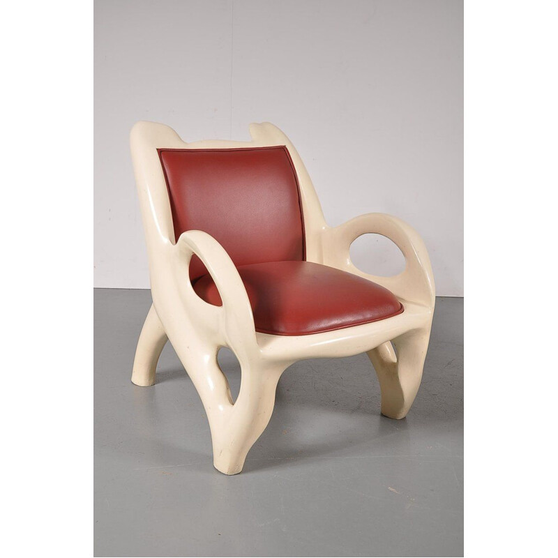 Paire de fauteuils vintage en cuir rouge et bois 1970