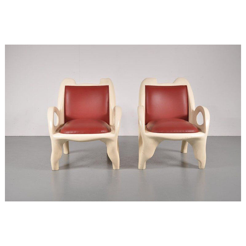 Pair of vintage armchairs in red leather and wood 1970