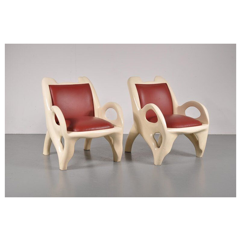 Pair of vintage armchairs in red leather and wood 1970