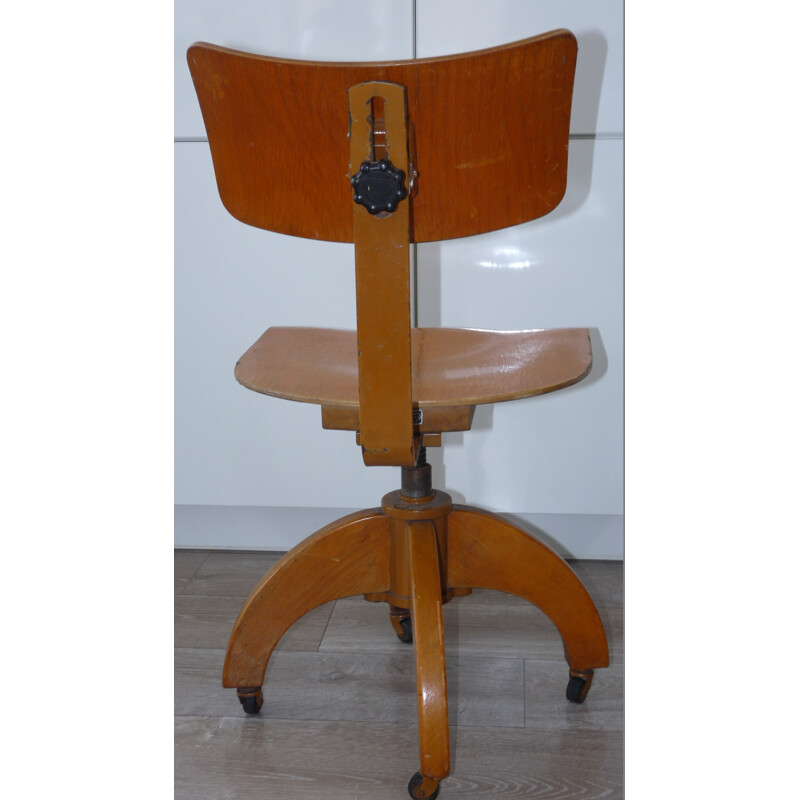 Chaise pivotante en bois et acier - 1950