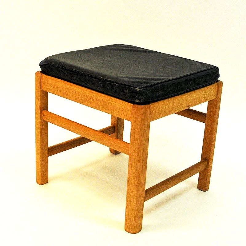 Vintage Scandinavian stool in oak with black leather seat from the 60s