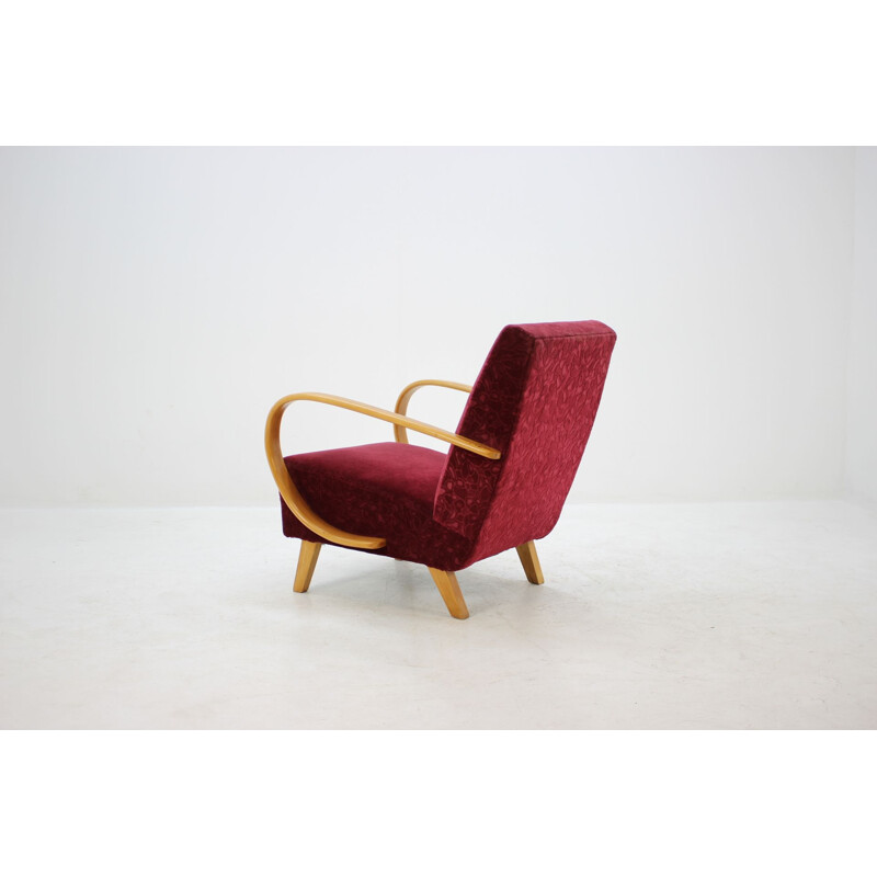 Vintage armchair by Halabala in red fabric and beechwood 1950