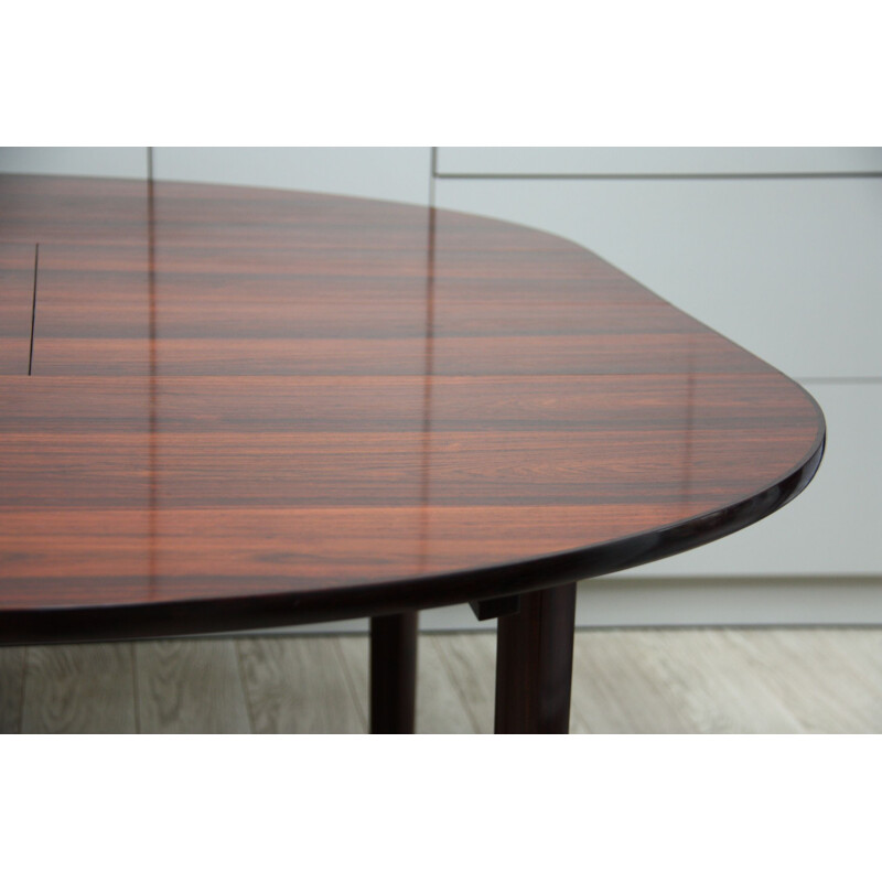 Vintage dining table in rosewood with integrated extension leaves
