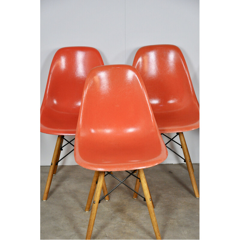 Set of 12 vintage red chairs by Eames for Miller 1970