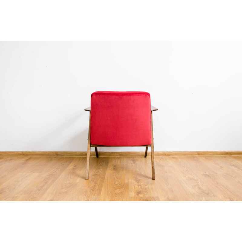 Vintage armchair in beech and red fabric