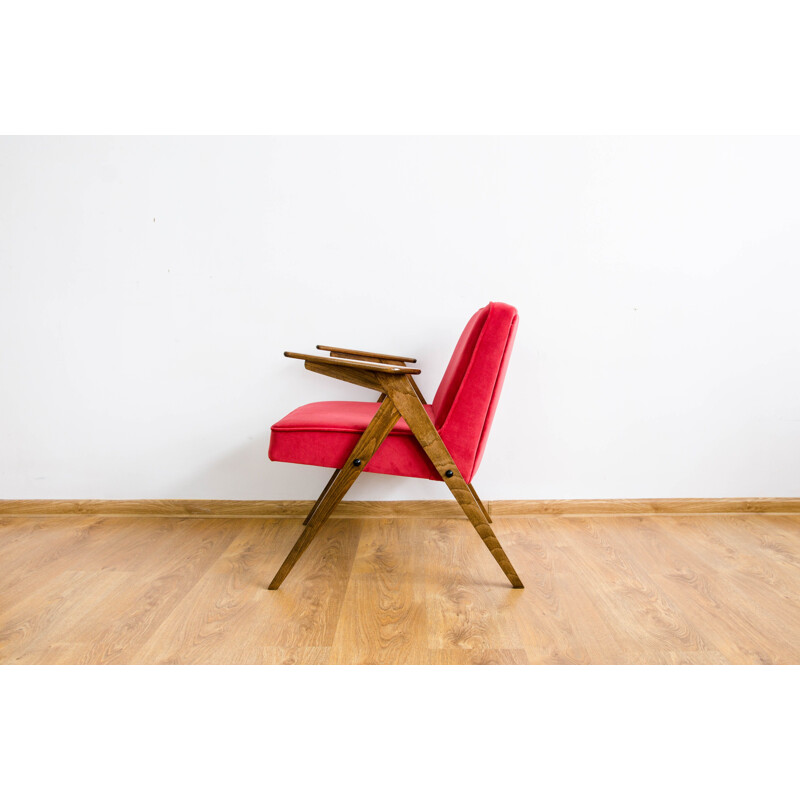 Vintage armchair in beech and red fabric