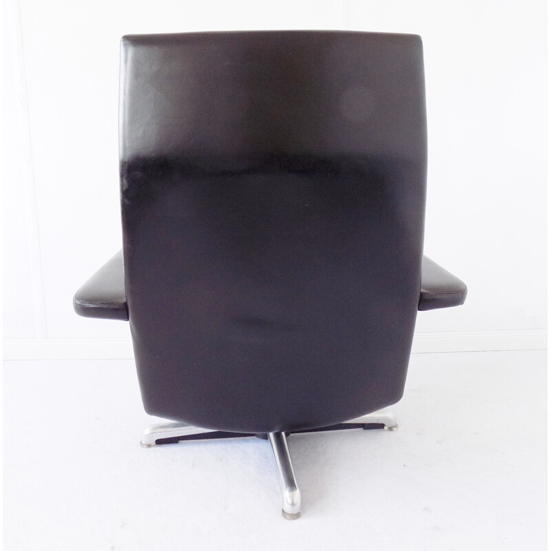 Vintage black armchair by Hans Kaufeld