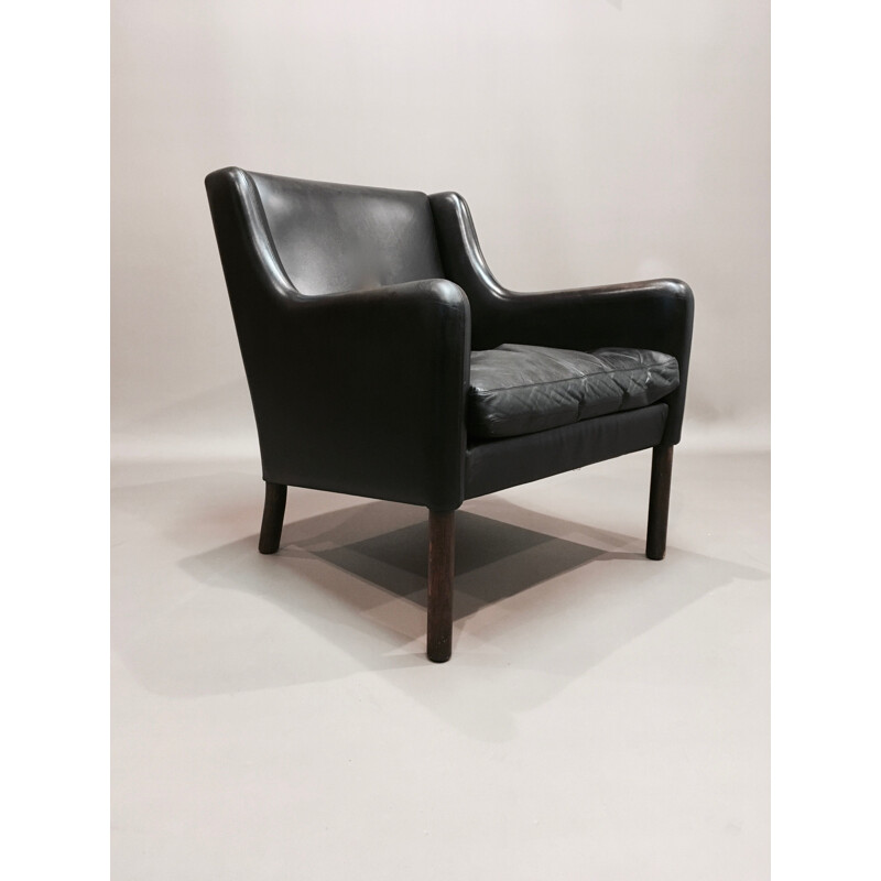 Scandinavian armchair in black leather and rosewood