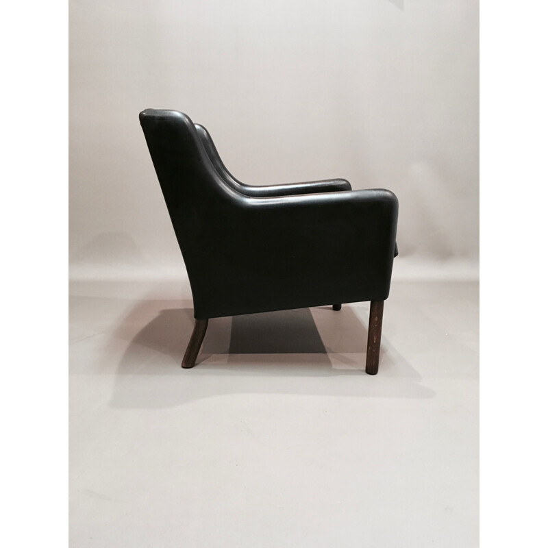 Scandinavian armchair in black leather and rosewood