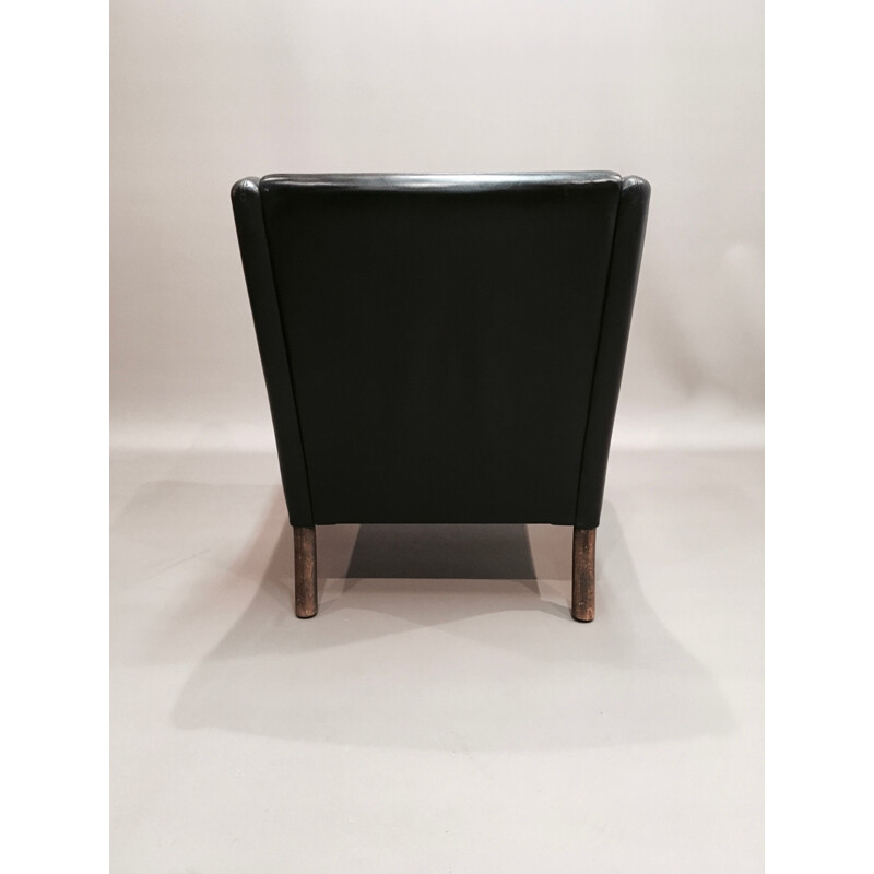 Scandinavian armchair in black leather and rosewood