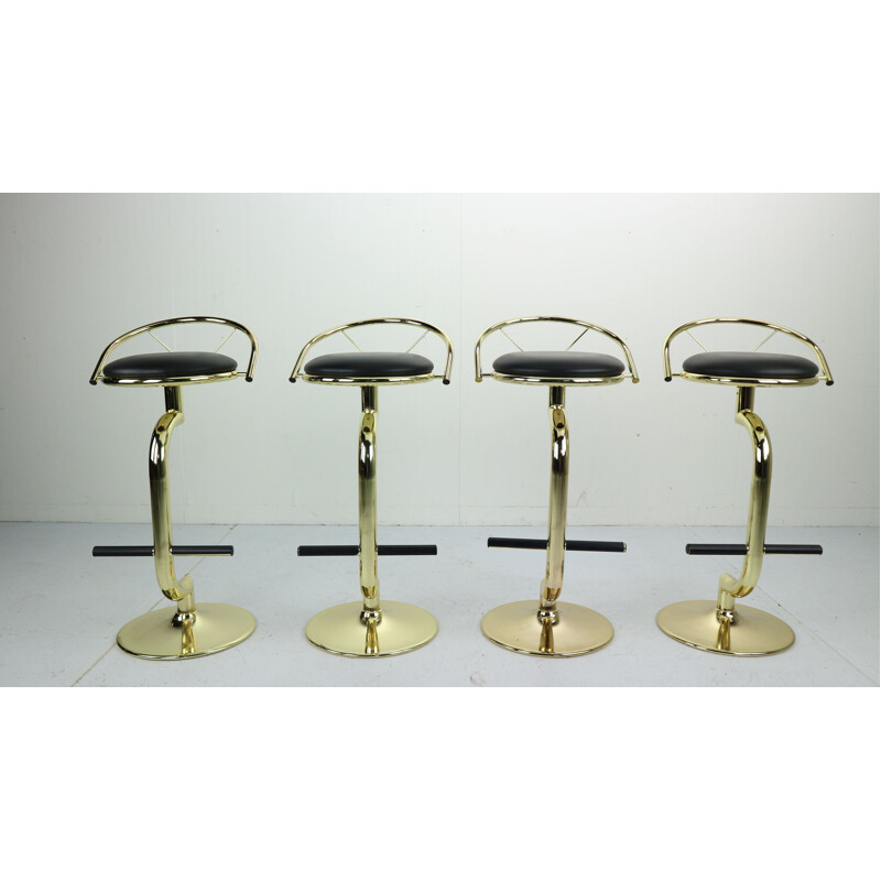 Suite de 4 tabourets vintage de bar en laiton et simili cuir noir