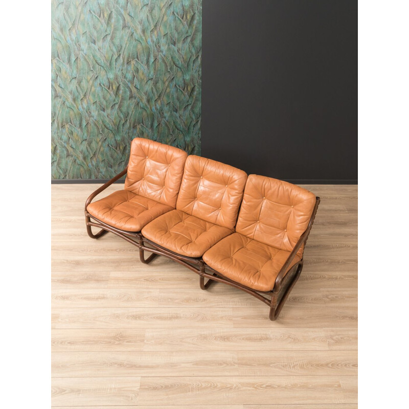 Vintage sofa in brown leather and with a bamboo frame 1960