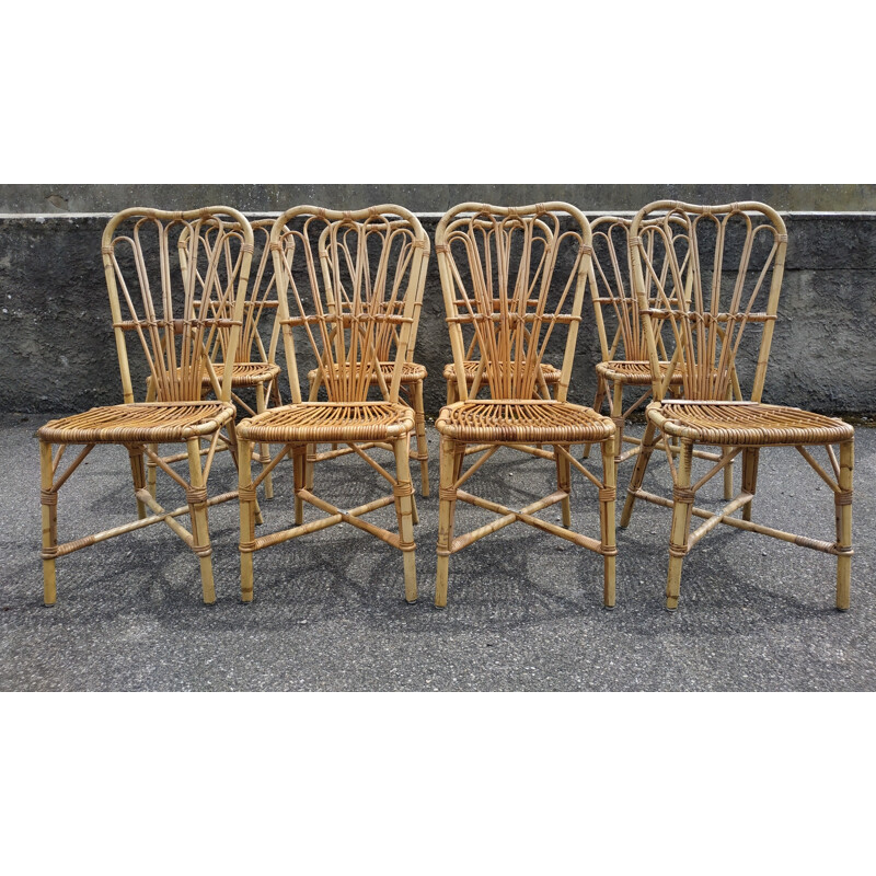 Set of 8 vintage chairs in rattan Audoux and Minnet France 1950