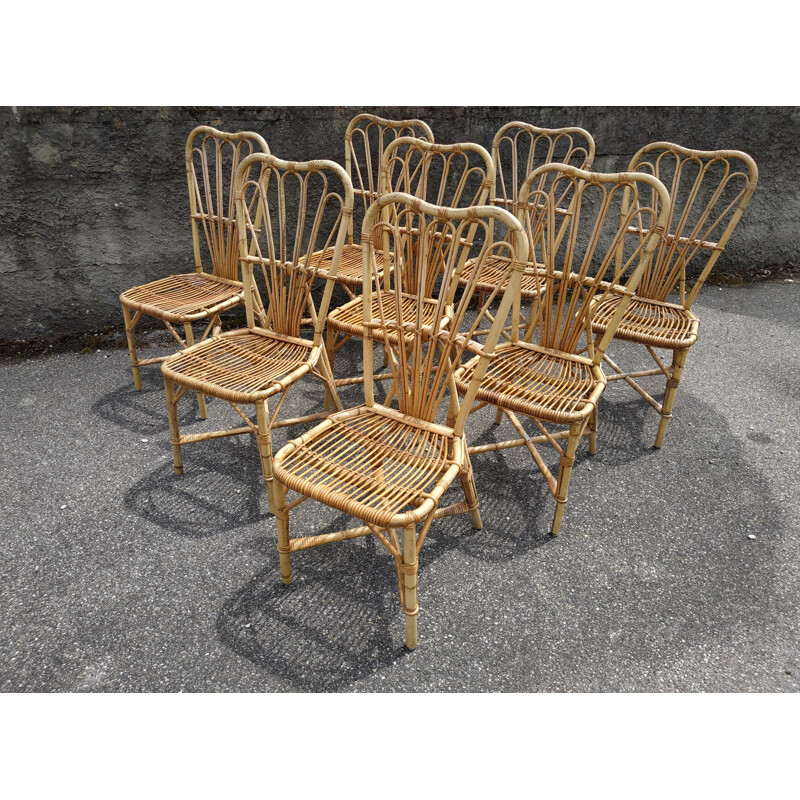 Set of 8 vintage chairs in rattan Audoux and Minnet France 1950