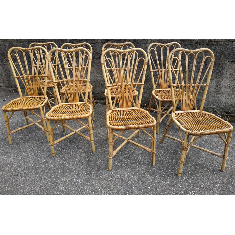 Set of 8 vintage chairs in rattan Audoux and Minnet France 1950