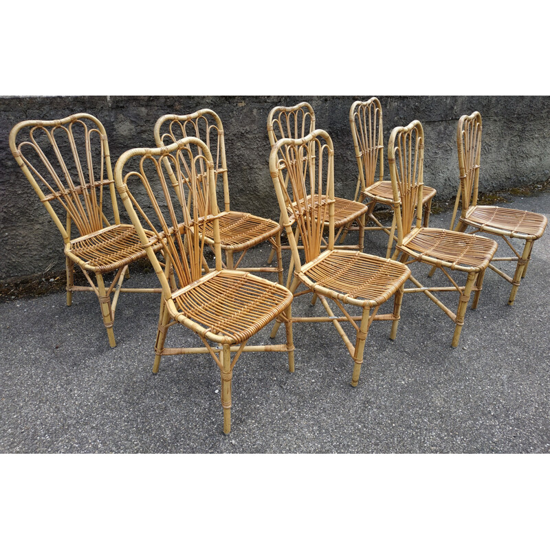 Set of 8 vintage chairs in rattan Audoux and Minnet France 1950