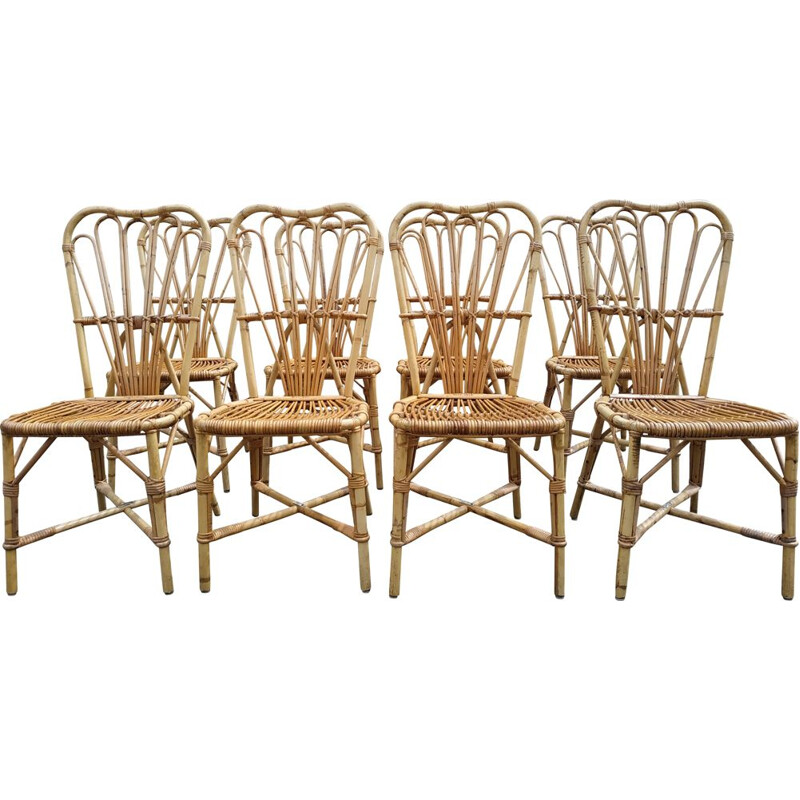 Set of 8 vintage chairs in rattan Audoux and Minnet France 1950